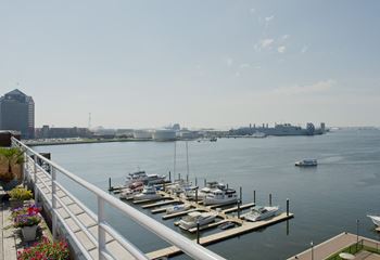 The view of the harbor from the deck of a marina with boats docked